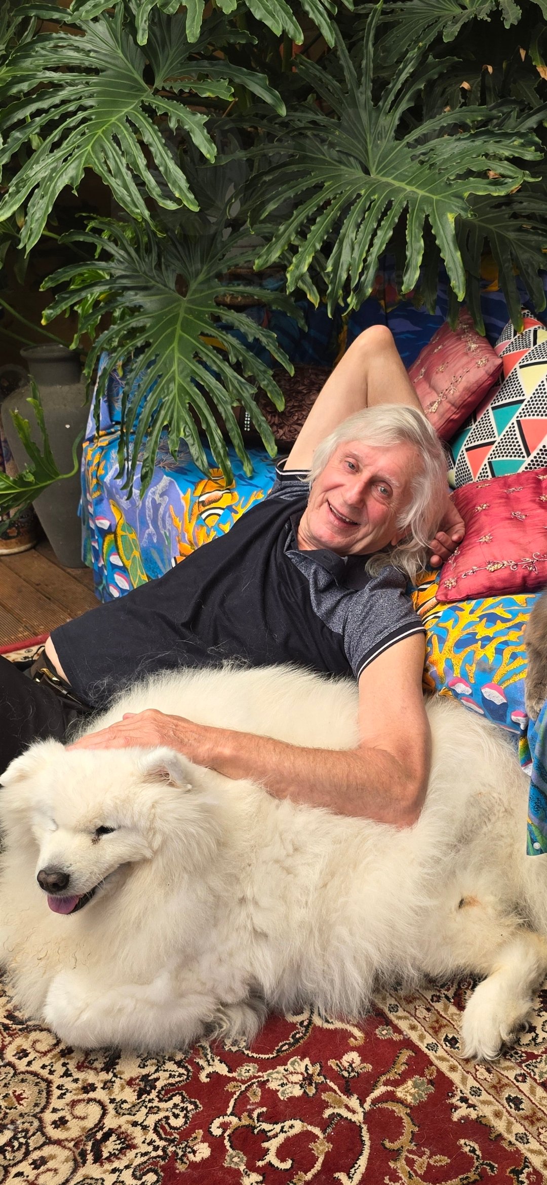 Arthur Galletly relaxing with Mishka